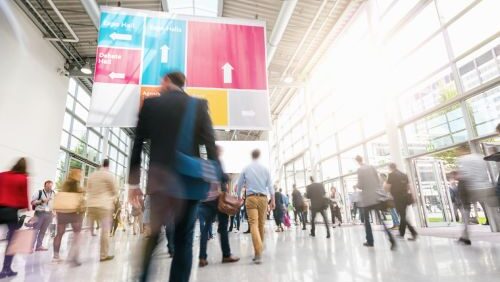 people walking at crowded conference